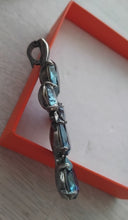 Load image into Gallery viewer, Side view of cross shaped pendant