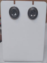 Load image into Gallery viewer, Pair of oval stud earrings on a white card.