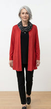 Load image into Gallery viewer, Model wearing a red open front jacket, black top, black pants and black polkadot scarf