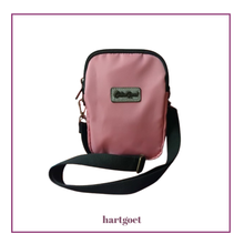 Load image into Gallery viewer, Pink crossbody bag with a visible brand "Cotton Road" logo on a white background