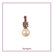 Load image into Gallery viewer, Pearl pendant with decorative top on a white background.