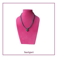 Load image into Gallery viewer, Necklace with a green pendant on a pink mannequin bust.