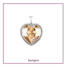 Load image into Gallery viewer, Heart-shaped pendant with amber-colored crystal and silver frame on a white background.