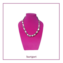 Load image into Gallery viewer, Necklace on a pink mannequin with 'hartgoet' branding