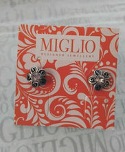 Load image into Gallery viewer, Flower-shaped earrings on a Miglio branded card with decorative design