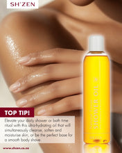 Load image into Gallery viewer, Bottle of Sh'Zen Natural Tissue Shower Oil and a woman using the product and info about how to use it