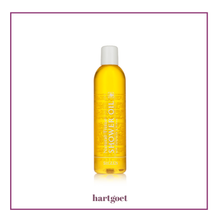 Load image into Gallery viewer, Yellow bottle of Sh'Zen Natural Tissue shower oil with a white cap on a light beige background, featuring the brand 'hartgoet'.