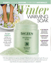 Load image into Gallery viewer, SH'ZEN Spa Additive foot soak in a clear plastic tub with a white lid, shown with pale green bath salts spilled in front. The background features a lifestyle photo of feet soaking in a green bath with lemon slices, alongside product descriptions and benefits.