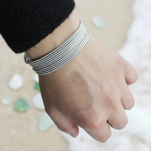 Load image into Gallery viewer, Silver Slinky Bracelets on a person's arm
