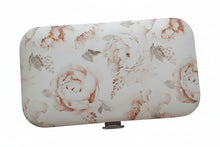 Load image into Gallery viewer, Floral-patterned manicure set on a textured surface