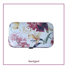 Load image into Gallery viewer, Floral-patterned case with 'hartgoet' branding on a white background