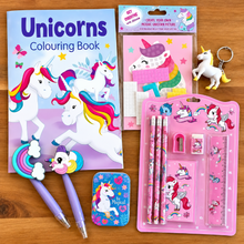 Load image into Gallery viewer, A unicorn-themed stationery and coloring set arranged on a wooden surface, including a large 'Unicorns Colouring Book,' pink ruler and pencil set in a blister pack, a small metal tin, mosaic picture, eraser, pencil sharpener, and a small unicorn keychain.