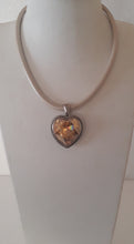 Load image into Gallery viewer, Heart shaped pendant on a cream leather necklace