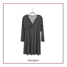 Load image into Gallery viewer, Black and white polkadot dress on a white background
