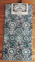Load image into Gallery viewer, Patterned table runner with 'The Cape Art Company' label on a wooden surface
