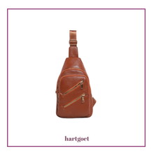 Load image into Gallery viewer, Brown imitation leather sling bag with zippers on a white background, branded 'hartgoet'.
