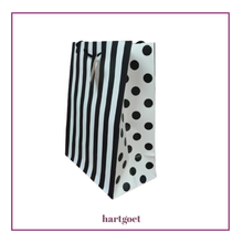 Load image into Gallery viewer, Black and white striped and polka dot paper bag on a white background
