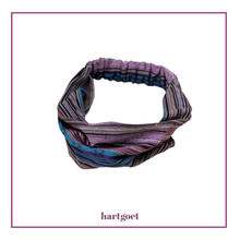 Load image into Gallery viewer, Multicolored patterned hair band on a white background.  
