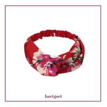 Load image into Gallery viewer, Floral headband with red background on a white background
