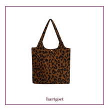 Load image into Gallery viewer, Leopard print tote bag with 'hartgoet' branding on a white background
