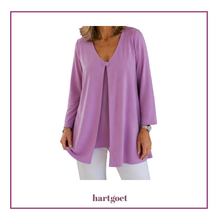 Load image into Gallery viewer, A woman wearing a lavender purple long-sleeve open-front jacket with a V-neckline and one button, paired with white pants. The image is framed with a purple border and features the brand name 'hartgoet' at the bottom.
