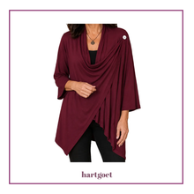 Load image into Gallery viewer, A woman wearing a burgundy draped wrap-style cardigan with three-quarter sleeves and a cowl neckline, shown against a white background with a purple border. The brand name 'hartgoet' is printed at the bottom.
