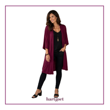Load image into Gallery viewer, Model wearing a long maroon jacket, black top and pants
