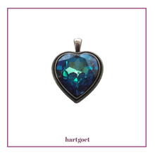 Load image into Gallery viewer, Heart-shaped pendant with blue crystal on a white background.  
