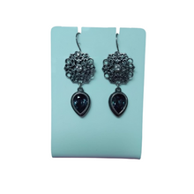 Load image into Gallery viewer, Miglio earrings with dark blue Swarovski crystals on a earring stand
