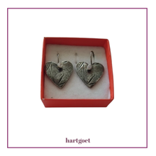 Load image into Gallery viewer, Heart-shaped silver earrings in a pink box.  
