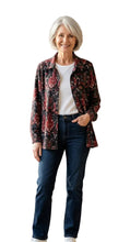 Load image into Gallery viewer, Woman wearing a floral jacket and dark jeans on a white background 
