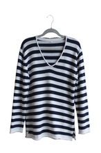 Load image into Gallery viewer, Cotton navy and white V-neck jersey by Earth Angel Clothing on a hanger against a white background
