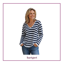 Load image into Gallery viewer, Model wearing  a white and navy jersey on a white background
