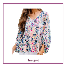 Load image into Gallery viewer, Multicolored floral blouse worn by a person on a white background with 'hartgoet' branding.
