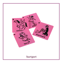 Load image into Gallery viewer, Set of pink plastic rubbing plates with black illustrations and text, featuring unicorn, pixie, fairy, and mermaid designs.  
