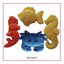 Load image into Gallery viewer, Set of colorful plastic sea creature sand moulds on a white background.
