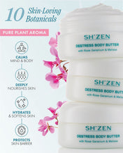 Load image into Gallery viewer, Three white jars of SH'ZEN Destress Body Butter stacked vertically on the right, with pink botanical flowers and text on the left highlighting '10 Skin-Loving Botanicals' and product benefits.
