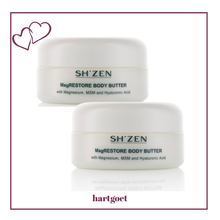 Load image into Gallery viewer, Two jars of Sh'Zen MagRestore Body Butter on a white background with a decorative border.
