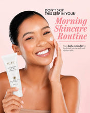 Load image into Gallery viewer, A smiling woman applies white cream to her face while holding a tube of SH'ZEN Day Cream SPF 30. The image features promotional text on a soft pink background.
