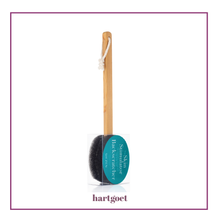 Load image into Gallery viewer, Bath brush with a wooden handle and black bristle head, featuring a teal circular label, on a white background.
