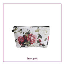 Load image into Gallery viewer, Floral-patterned pouch with 'hartgoet' branding on a white background
