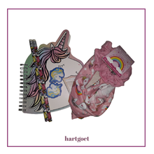 Load image into Gallery viewer, Unicorn-themed notebook, pencils, erasers and hairband and scruncie on a white background
